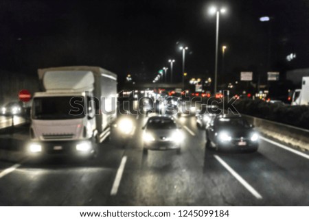 Traffic on a highway night blurred