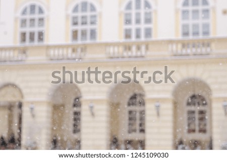 Blurred winter background city life bad weather lifestyle blizzard christmas cold falls snow tourists panorama old city