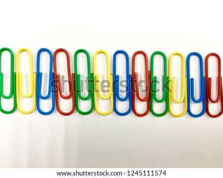 Colorful paper clip on white background