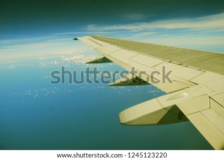 Airplane wing and the blue sky
