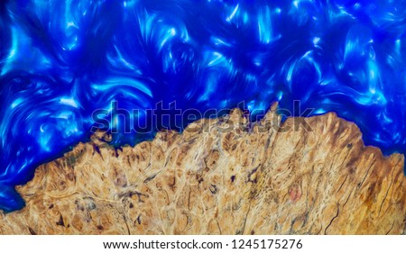 casting epoxy resin Stabilizing Afzelia burl exotic wood blue background texture, Abstract art picture photo, print design and your advertisement, hybrid