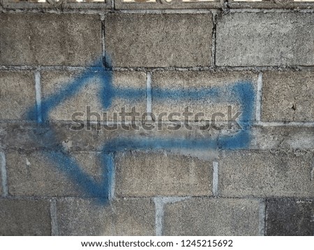 Arrows turn left blue on the wall. 