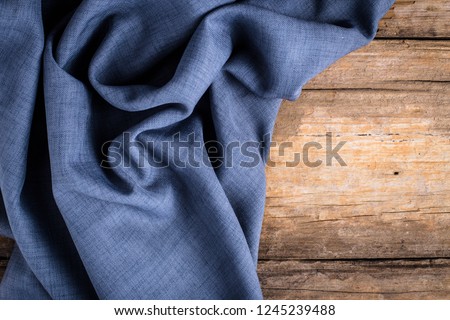 blue fabric on wooden background