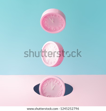 Pastel pink wall clocks on blue backdrop falling down. Time concept. Minimal composition. Royalty-Free Stock Photo #1245252796