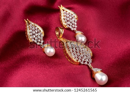 Diamond jewelry placed on cloth with earrings diamond pendant,diamond jewellery