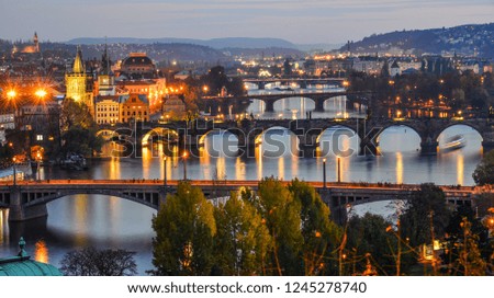 View of bridges on Vltava River at night in Prague (Praha), Czechia.