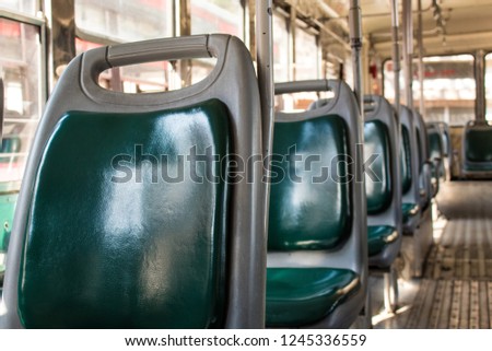 Indian public bus experience; empty bus with green seats and metal