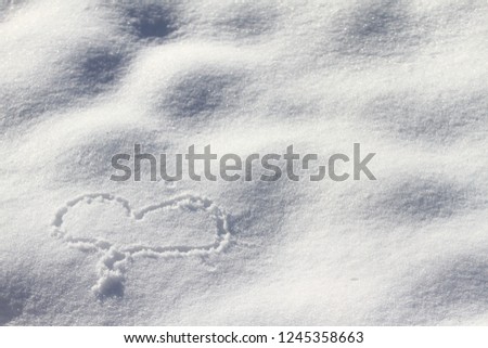 Heart on the white snow