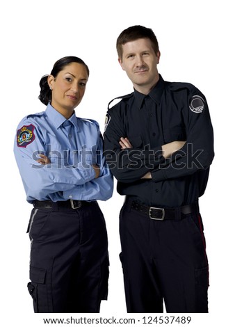Portrait of two mid adult police officers standing on a white background