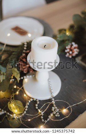 christmas kitchen interior table decorated by lights gifts toys candles holiday concept
