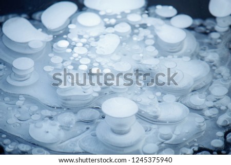 ice backaground, natural ice texture with frozen air bubbles 