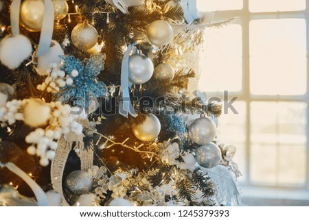 christmas decorative gifts toys stars garland and fire in background bokeh lights holiday concept