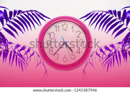 a colorful wall clock with palm kernel