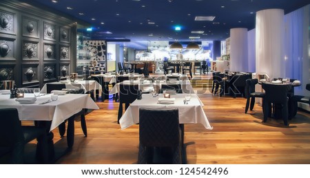 modern Amsterdam's restaurant with open kitchen Royalty-Free Stock Photo #124542496