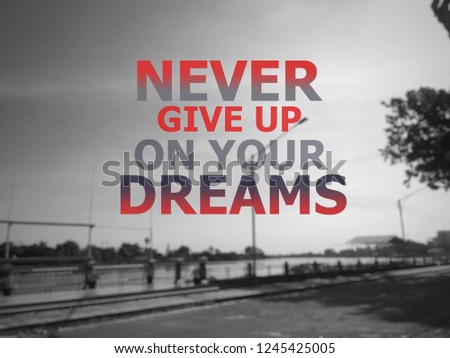 Inspirational quote on blurred background.