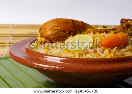 Isolated chicken biryani, Closeup of traditional indian or pakistani food, Spicy fried rice, Ramadan iftar meal, Eid dinner on white background, Christmas party lunch, Delicious diwali treat.