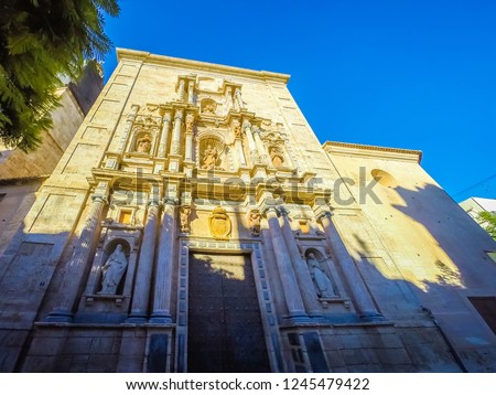 A photo of the beautiful exterior facade of the ancient Carmen convent located in Carmen square in downtown Valencia, Spain, Europe. The convent has a mix of medieval and gothic architectural styles