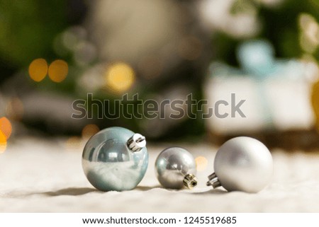 Pearl Grey Christmas balls close up on bokeh background