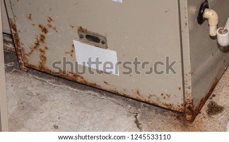 furnace has rusted and must be replaced Royalty-Free Stock Photo #1245533110