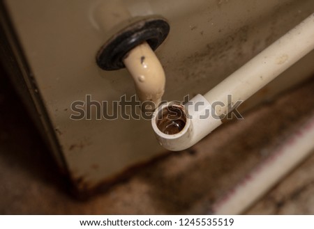 condensation drain has become plugged and must be cleaned Royalty-Free Stock Photo #1245535519