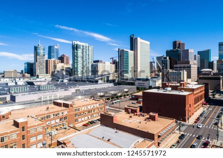 sunny afternoon in the modern city of Denver Colorado skyline cityscape skyscrapers and towers in the new development side of the mile high city