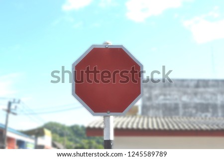 empty red traffic sign on blurred background