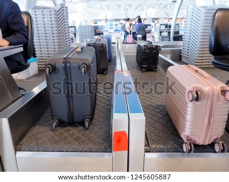 The luggage is on the belt to check the weight check-in airport before boarding.