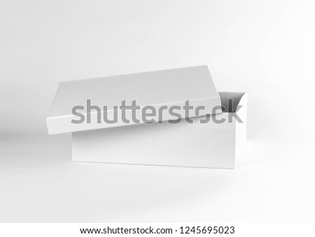 Empty clean box. Shoe box. Close up. Isolated on white background. Royalty-Free Stock Photo #1245695023