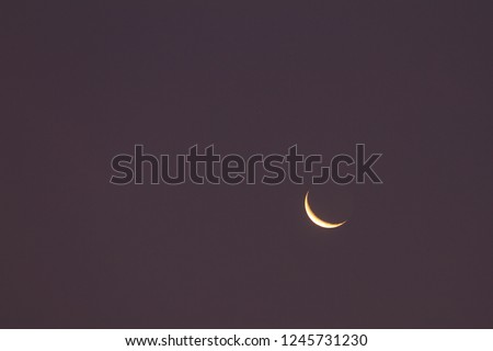 the moon on night clouds background, blur crescent moon on dark night background