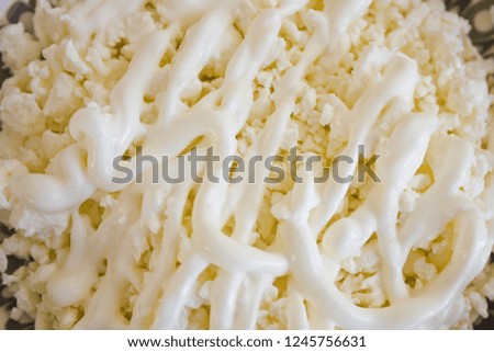 Fresh cottage cheese with sour cream  close up