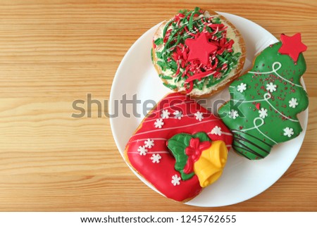 Plate of Vivid Color Christmas Decorated Sweets Served on Wooden Table with Free Space for Text and Design