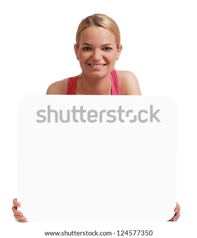 A young woman  holding an empty white bill board against a white background.