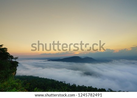Beautiful Clouds and fog above mountain, beautiful morning sunshine landscape at Pha Mo i Daeng Phra Wihan National Park. Sisaket province,Thailand,ASIA.