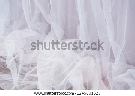 Pink transparent fabric organza or mesh, drape vertically. Abstract background
