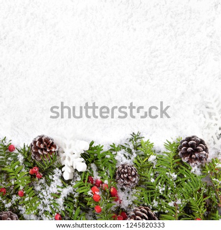 Christmas border with traditional decorations on the snow square