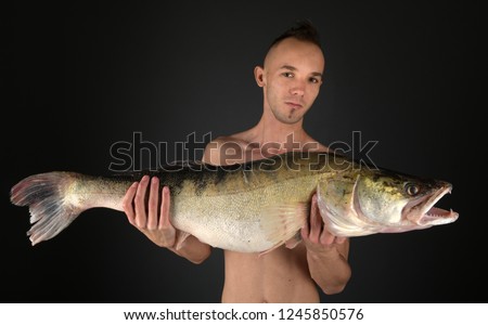 happy fisherman with big zander