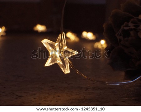 Illuminated star light string close up