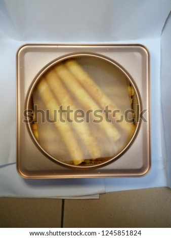 Hong Kong style biscuit roll on open package. Royalty-Free Stock Photo #1245851824