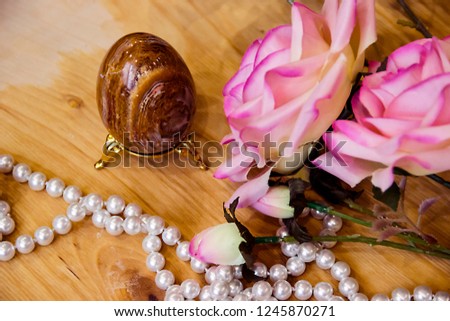 pictured in the photo artificial Easter egg with pink roses and pearl beads