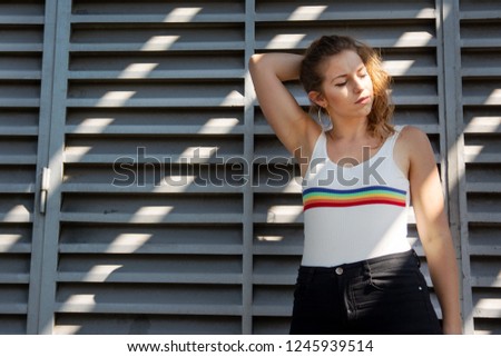 Blonde Teen Posing in the city with cool background and the sun light