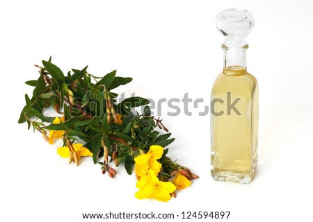 Bottle of oil with fresh evening primrose - isolated Royalty-Free Stock Photo #124594897