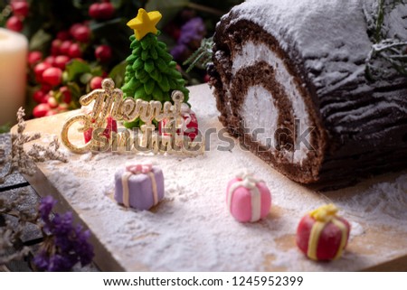 Picture of cakes with three blurred gift box for celebrate Christmas time/Selective focus