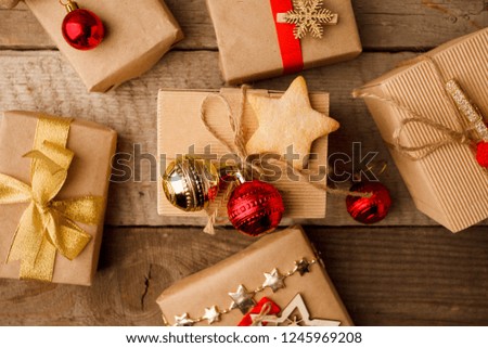 Set luxury New Year, Christmas gift. Happy New Year 2019. Christmas background with gift box red gold decor on vintage wooden table. Christmastime celebration.