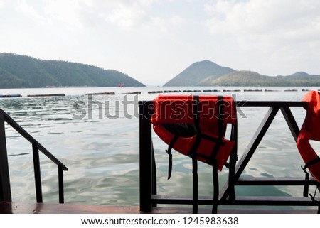Life jacket dried on ladders down stairs to beautiful lake
