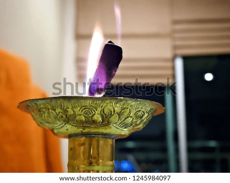 A burn candle for a merit 