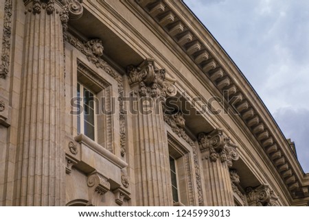Architecture in stone detail of facade and window in Paris