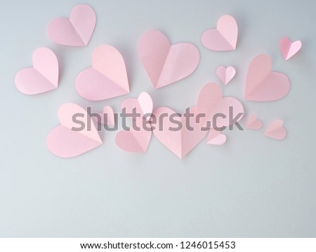 Pink paper hearts placed on white background. Space for design