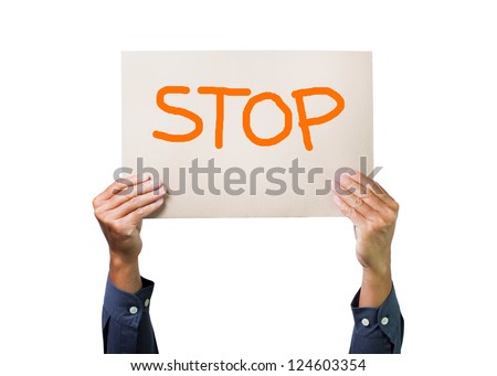 Two hands holding stop cardboard  overhead on white background