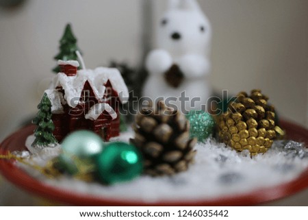 Christmas house decorated in snow white squirrel and new year cones. Home new year decorations. hand made decorations.