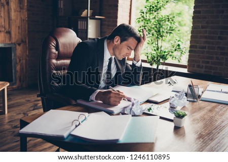 Profile side view portrait of elegant classy handsome sad man business shark ceo boss chief attorney lawyer writing article fail failure at work place station table desktop Royalty-Free Stock Photo #1246110895